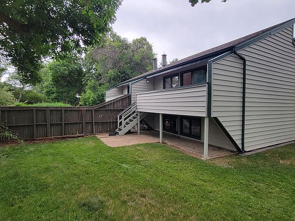 Back yard, deck, spacious grassy area.