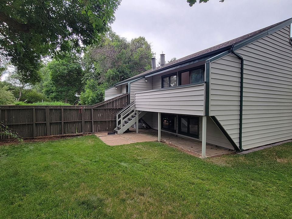 Back yard, deck, spacious grassy area.