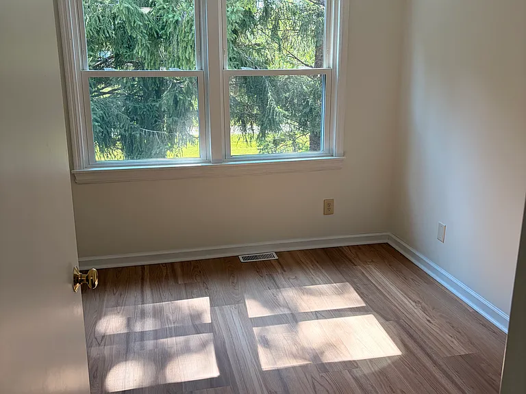 3rd bedroom with new vinyl flooring facing west