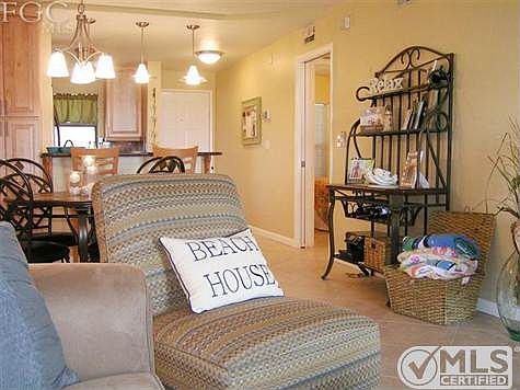 View to Front Door, guest suite with pocketing door privacy, full bath, and in unit laundry.