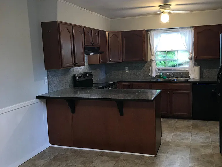 Kitchen and eating area. Granite to be replaced with newer granite