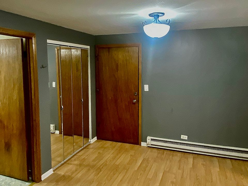 Dining room and entry with coat closet and bathroom door