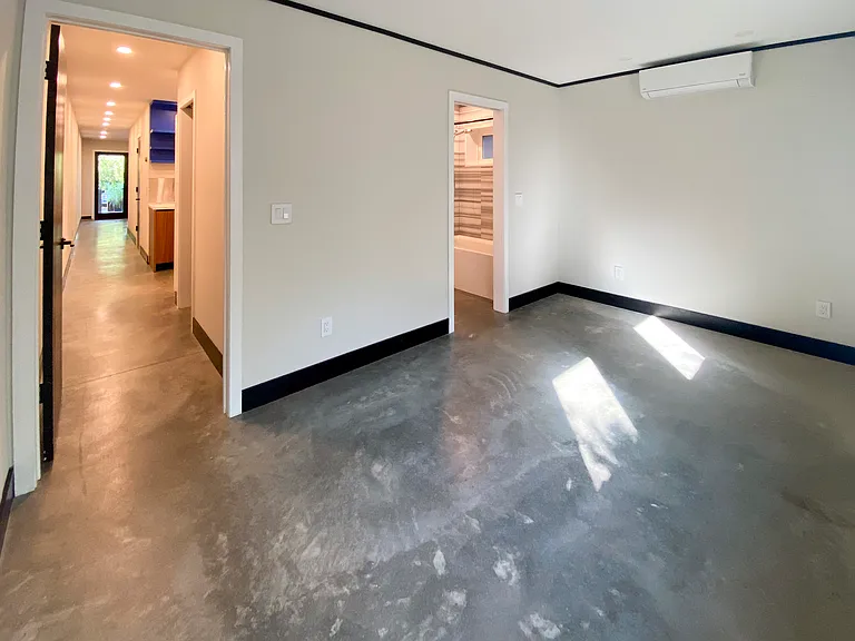 Bedroom with entrance to bathroom