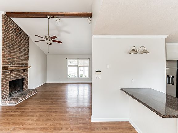 Living room opens to a dining room overlooking a large bay window and backyard. Breakfast bar with room for stools.