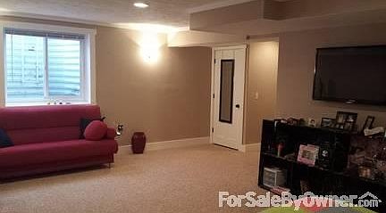 Basement (currently used as a bedroom) 15'x22' (door shows storage under stairs)
