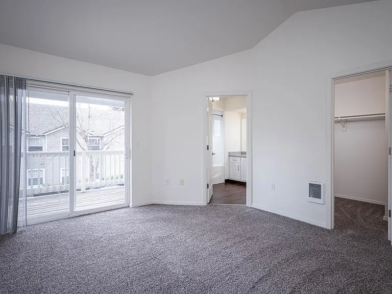 Village at Main Street | 2x2 Bedroom Spacious Bedroom with Wall to Wall Cabinetry and Patio Access