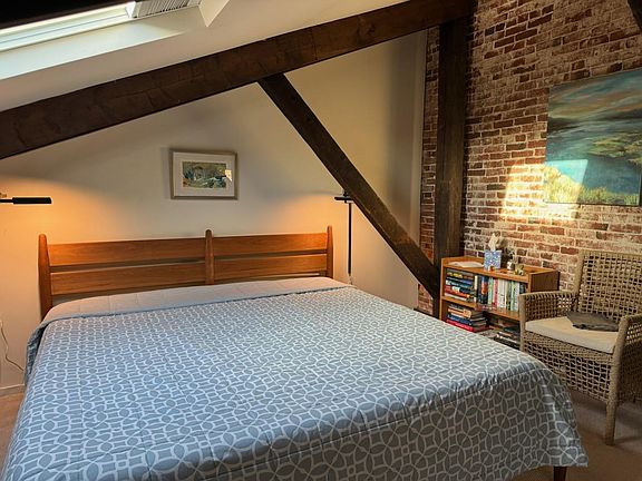 New King size bed with brand new mattress in loft master bedroom - Loft bedroom stretches the length of the condo and accomodates a large 8 drawer cherry bureau and desk. Two skylights bring brightness and fresh air ( in season) into the loft.