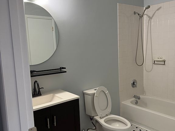 Spacious bathroom with plenty of storage.