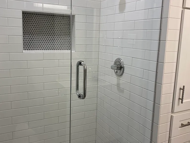 Tiled shower with glass in en-suite bathroom