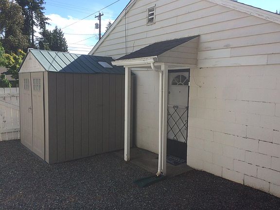 Storage shed and side enterance.