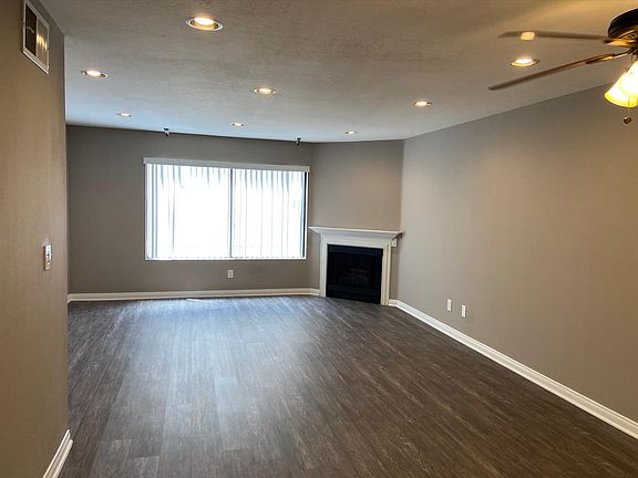 Living room with fireplace and recessed lighting