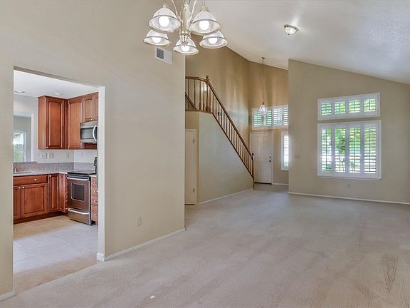Formal dining area and living room area.