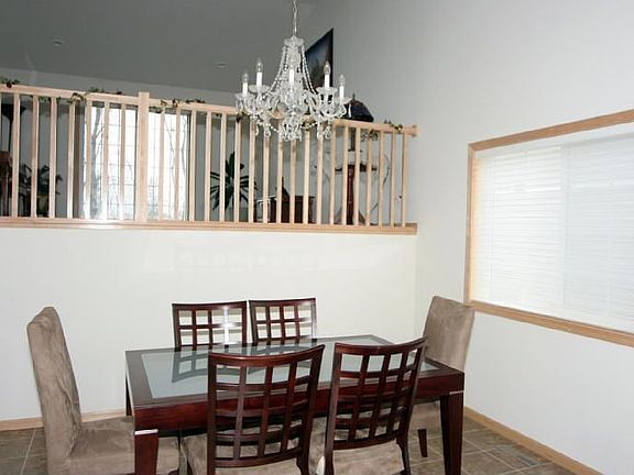 Open and vaulted floor plan with living room terraced above the dining room!