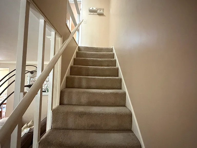 Stairs go up to the 2 bedrooms and a full restroom.