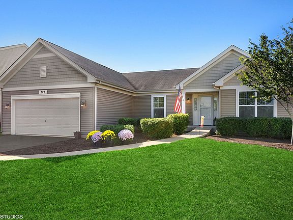 Great curb appeal and nicely landscaped, now with fresh mulch and mums planted!