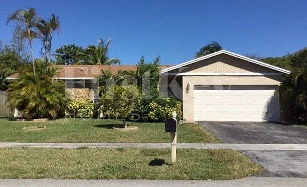 9703 NW 42nd Ct — Photo 1