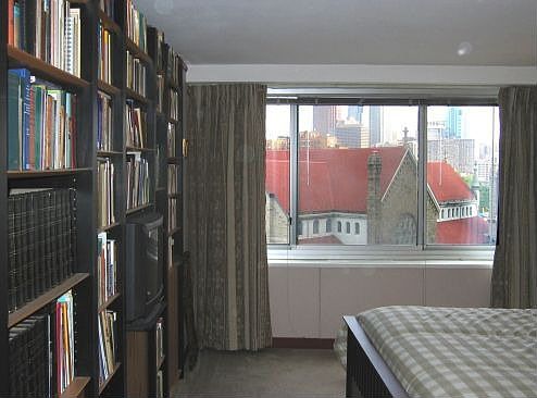 Bedroom; built-in bookshelves at left are included.