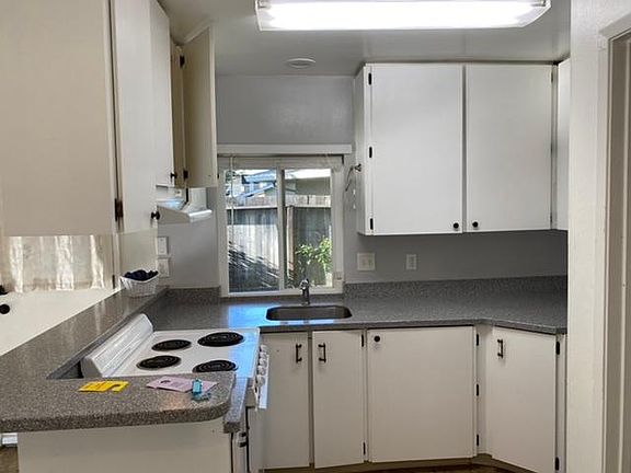 Nice kitchen with solid countertop and lots of cabinet space