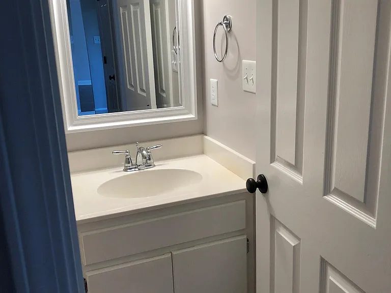 Second bathroom with solid surface countertop