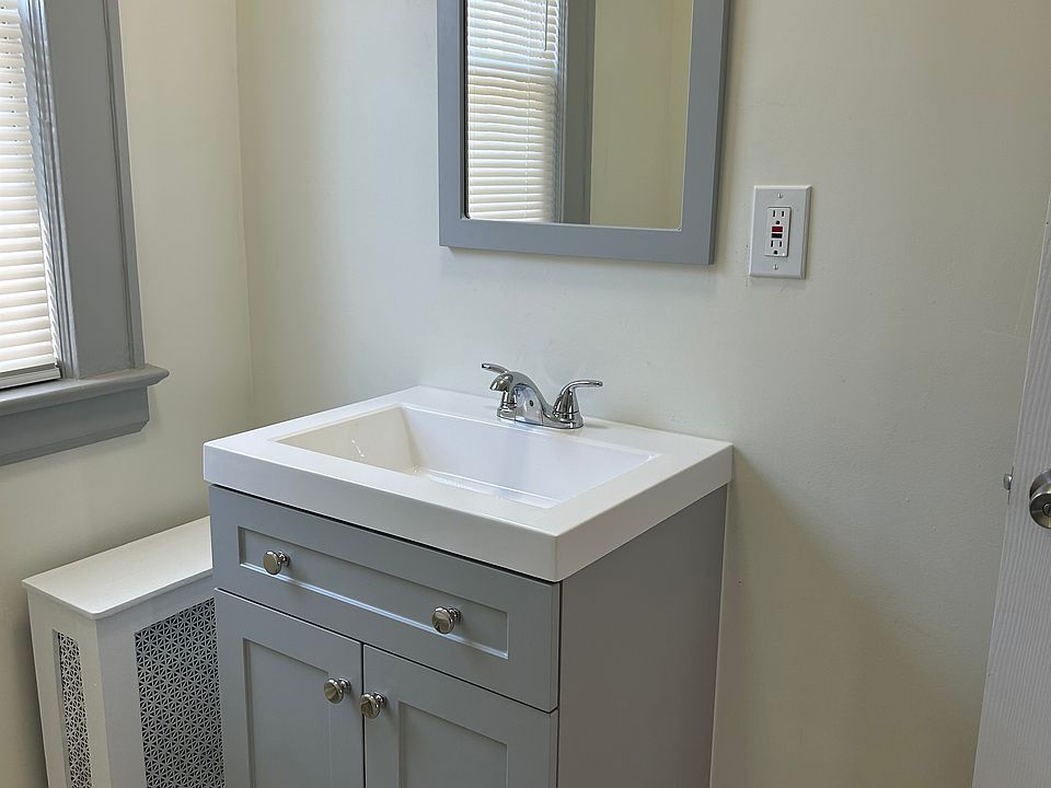 Bathroom Pic 2: New (tub/shower insert, faucets, floor, vanity/mirror, door, hardware, lighting, paint, blinds)