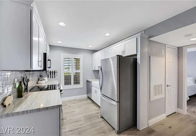 Kitchen with full sized refrigerator