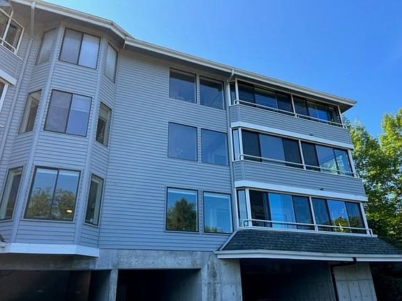 2nd floor corner unit, but with main floor entry from above parking area