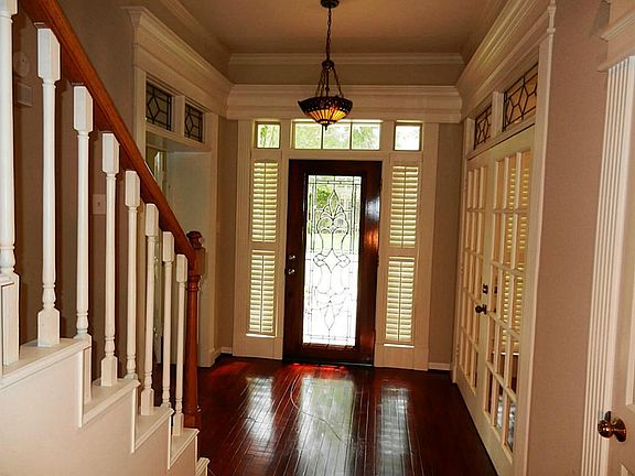 Stairs for the upstairs to the left and  to the front door to the left is the master retreat. With the private fireplace and dual vanities.