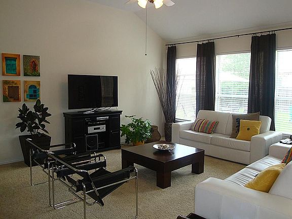 Large family room with high ceilings and plenty of natural light