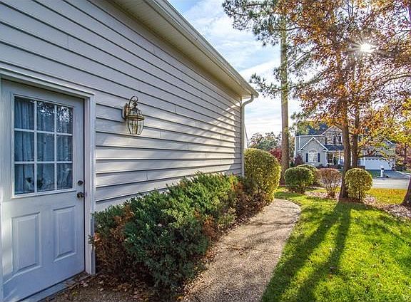 Garage side of house. Door goes into the Garage