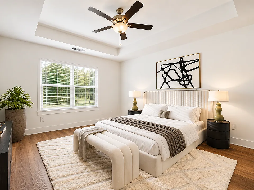 Spacious Primary Bedroom with Natural Light and Ceiling Fan