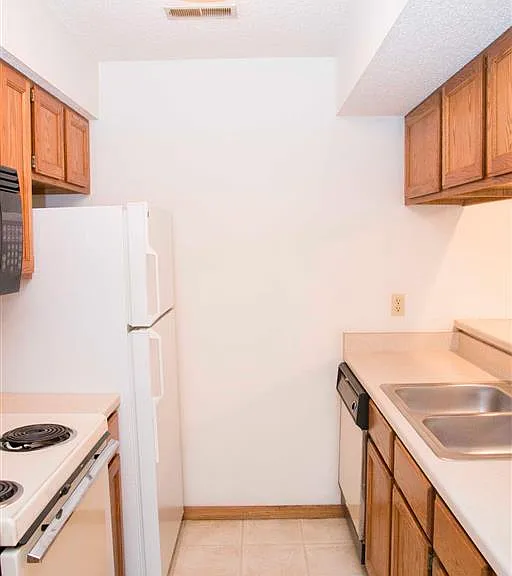 Everything you need within reachthis galley kitchen offers full-size appliances, a double basin sink, and plenty of cabinet space.