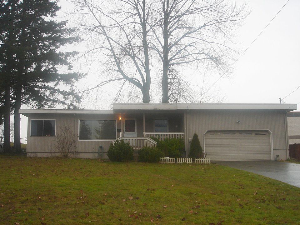 Front of house with huge front yard