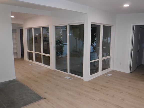 Living to dining room...all windows looking out into the courtyard!
Master entrance on right