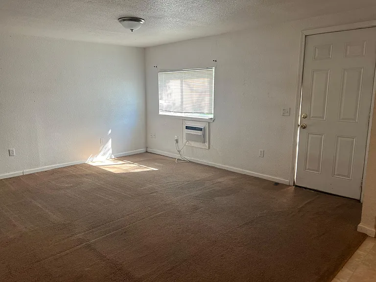 Front living room, but the carpet has been replaced... See other photos with stairs.