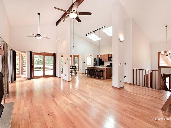Open Family Room to Dining Rm and Kitchen