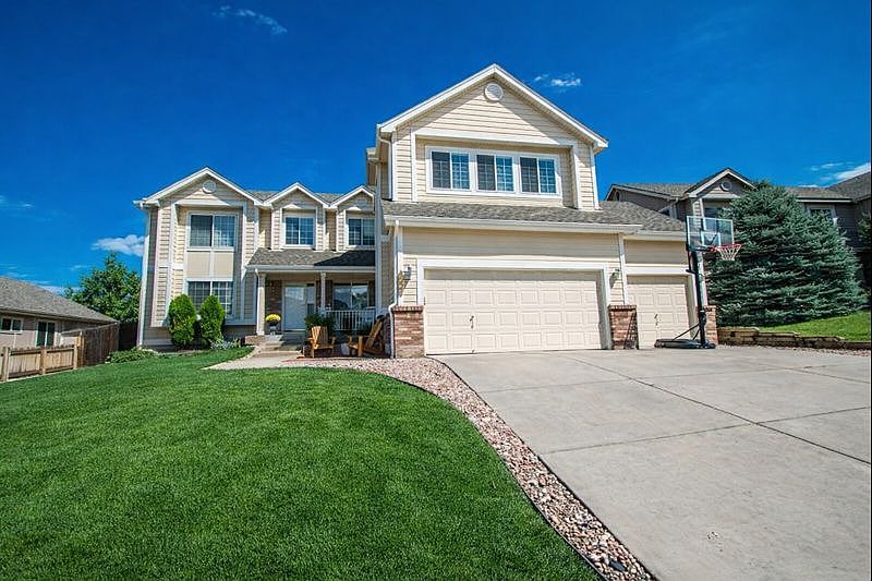 Rare 4BR Lone Tree home with 20x20 bonus room, main-floor study/5th bedroom, new Trex deck & 3-car garage