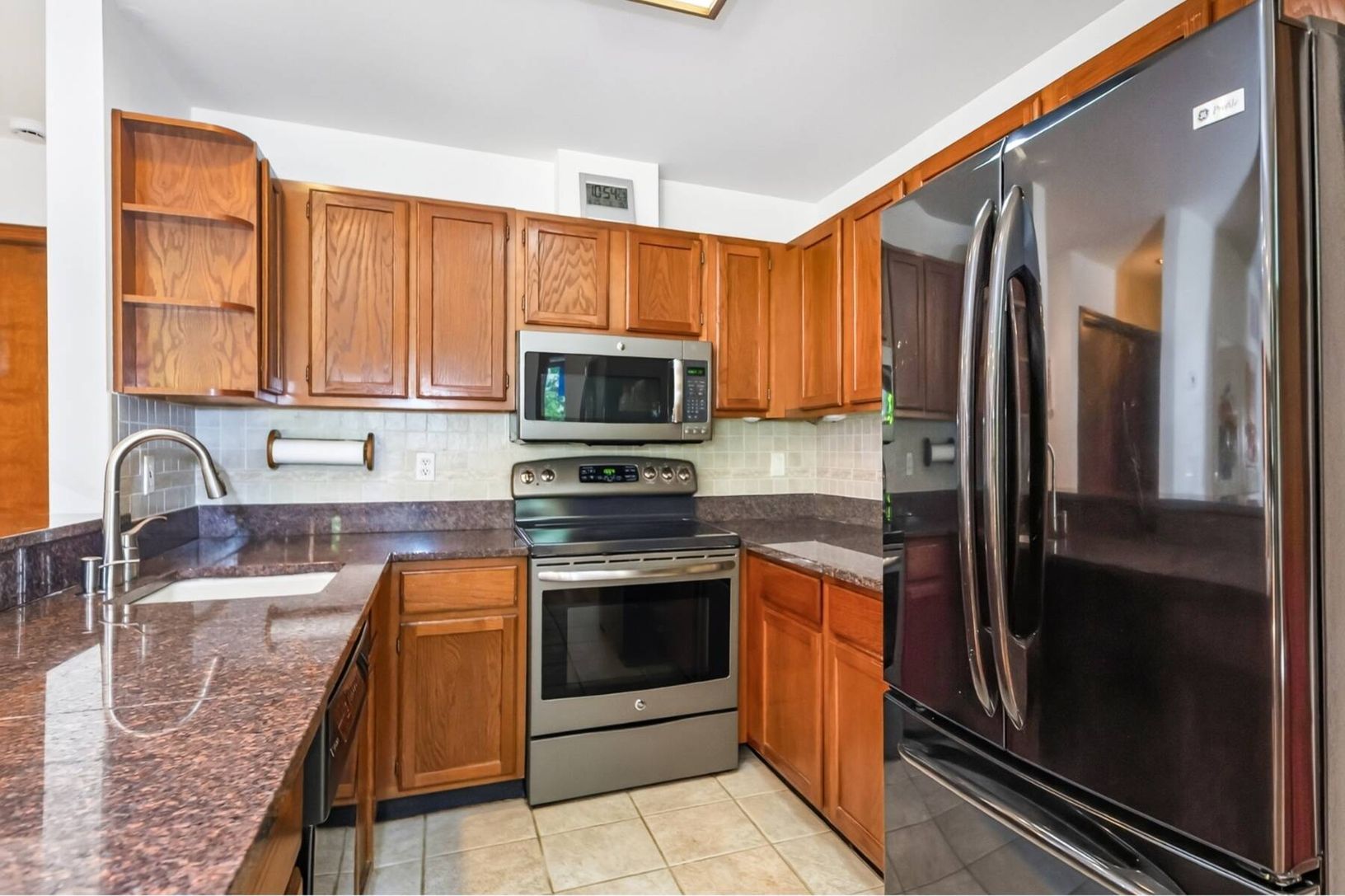 Warm wood kitchen with stone counters