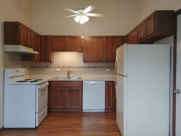 Kitchen with vaulted ceiling Electric stove, hood/vent, dishwasher & refrigerator