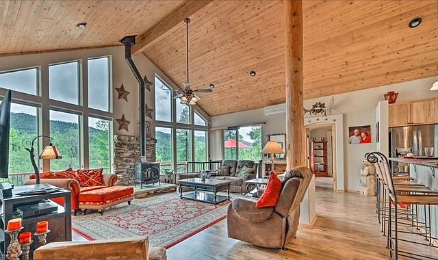Great room with smart tv and sound bar. Island with stool seating.