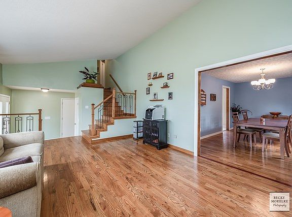 The living room is located just off the foyer and leads into the dining room.
