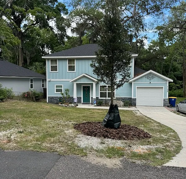 Front of house, extended driveway