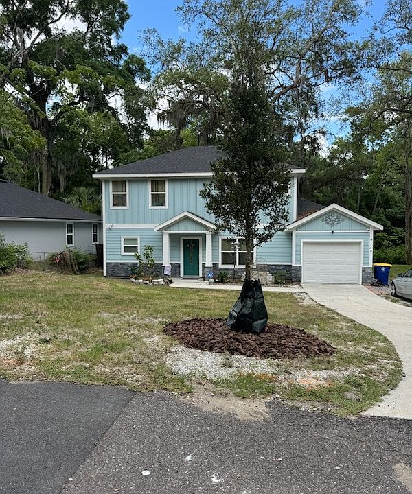 Front of house, extended driveway