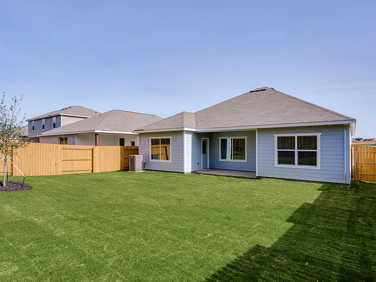 The back yard is fully fenced in.