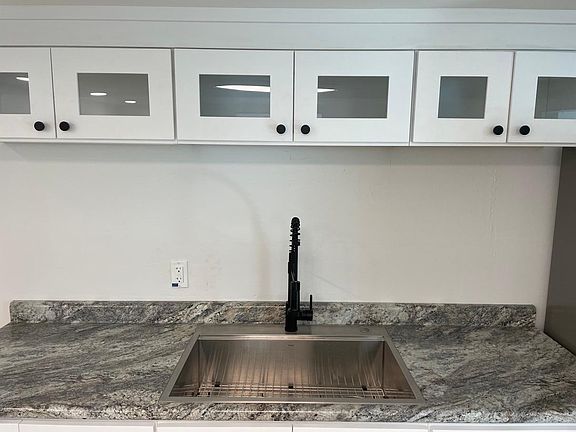 New 30" stainless steel sink + new faucet + new cabinetry.