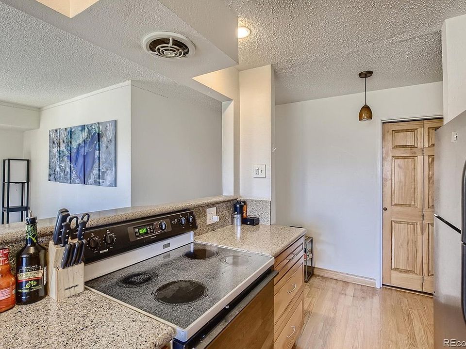 KITCHEN OVERLOOKS THE LIVING ROOM (no closed off galley kitchen in this gorgeous condo).