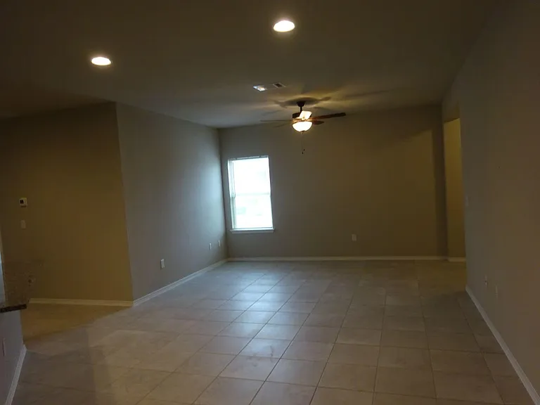 Large family room with ceiling fan