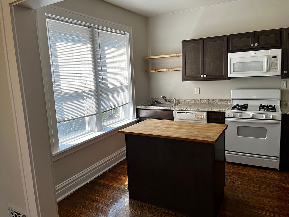 Updated kitchen with center island/ cabinetry