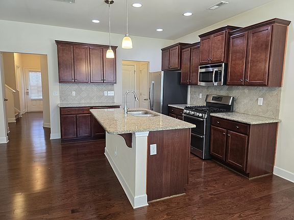 Kitchen with island for food prep and informal dining