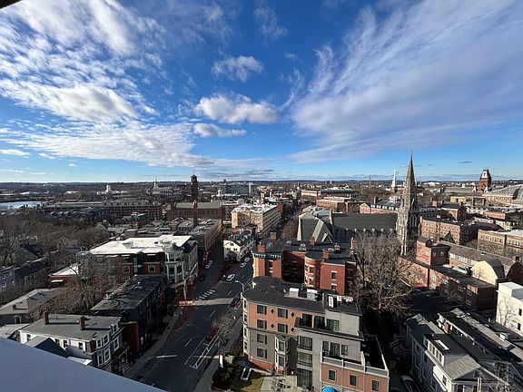 View from living room on 12th floor overlooking Harvard Sq and Charles River