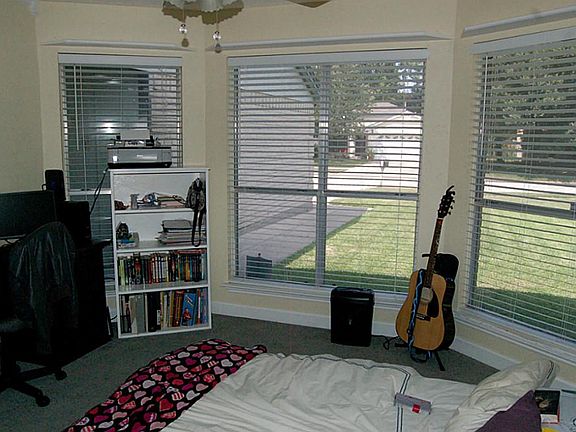 Light and Bright secondary room with large bay window.